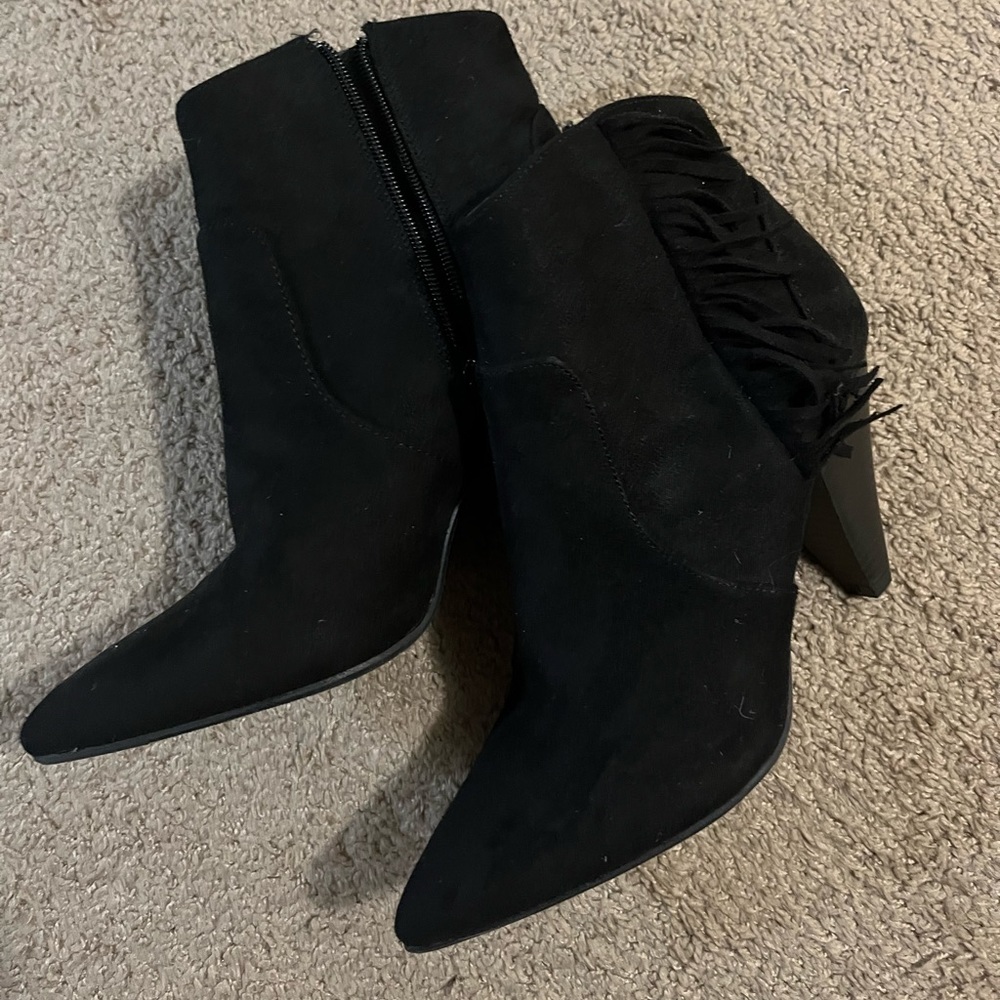 Black suede heeled boots with fringe